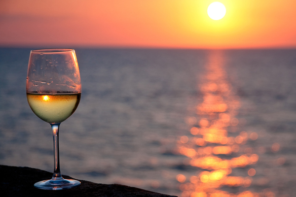 apulia-white-wine-glass-and-sunset